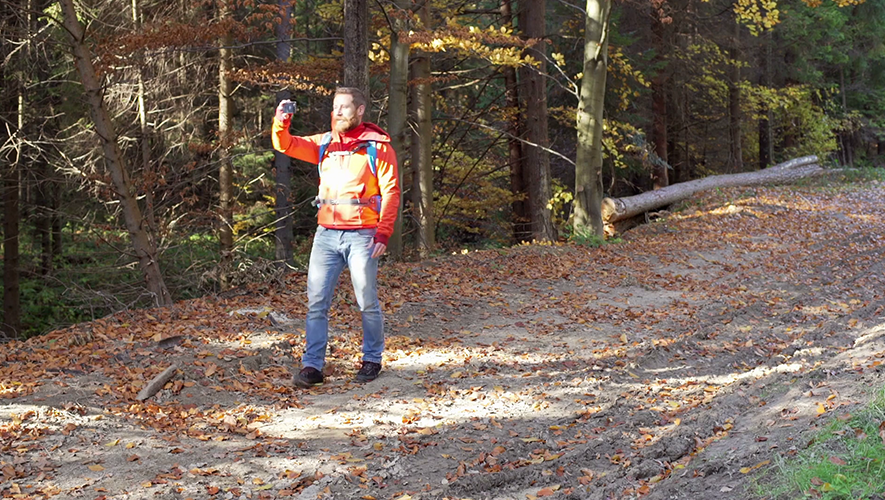 Geologist using his mobile phone in the field